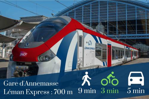 a red and white train parked at a train station at LA COLOC CHOCO - Belle Colocation en hypercentre / 5 chambres privées / Salle de bains privative / Proche Gare et Tram / Wifi et Netflix in Annemasse