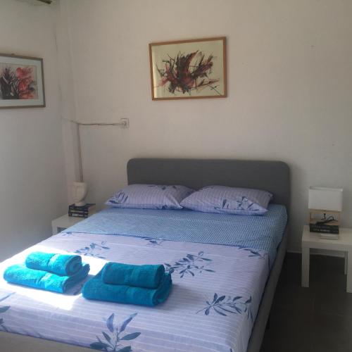 Ένα ή περισσότερα κρεβάτια σε δωμάτιο στο Yves apartment