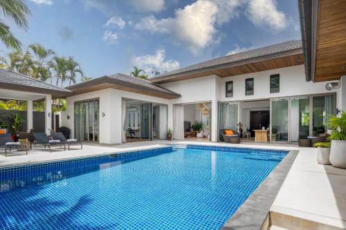 an image of a swimming pool in a villa at Tropical 3BR Holiday Villa with Pool, BBQ, and Shaded Patio within Walking Distance to Bang Tao Beach in Bang Tao Beach