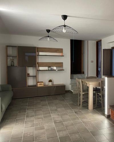 a living room with a couch and a table at AngeLina al borgo in Aieta