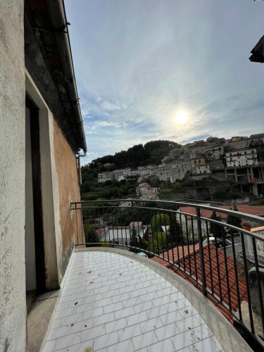 a balcony with a view of a city at AngeLina al borgo in Aieta