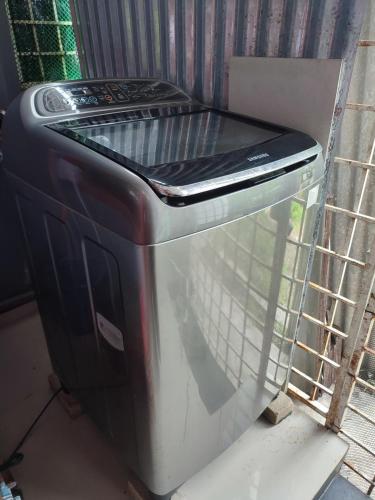a close up of a toaster oven sitting on a shelf at NikNa Homestay Batu Rakit - WIFI in Kampong Ru Tujoh