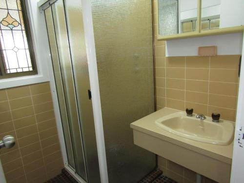 a bathroom with a sink and a shower at Hardwicke Haven in Brentwood