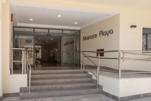 a lobby of a building with stairs and a welcome sign at Hotel Mainare Playa in Fuengirola