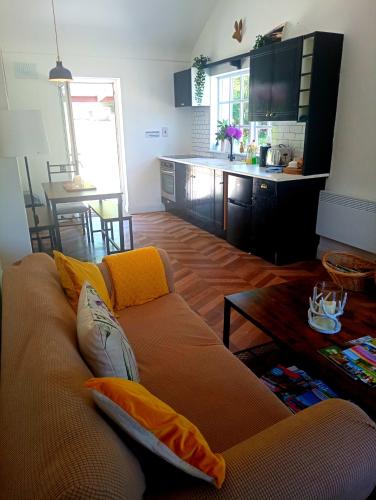 a living room with a couch and a table at Donegal cottage in Donegal