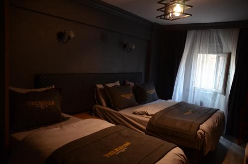 En eller flere senger på et rom på Tekirdağ Butik Otel Restaurant