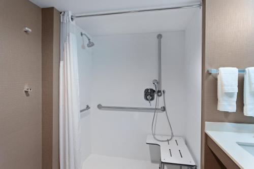 a bathroom with a shower and a sink at Holiday Inn Diamond Bar - Pomona by IHG in Diamond Bar