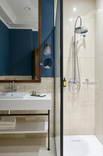 a bathroom with a sink and a shower at Andrássy Kúria & Spa in Tarcal