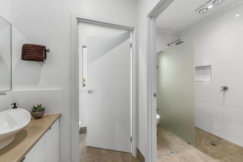 a white bathroom with a sink and a toilet at Bright & Easy - Address is 7 Cobb & C Way Pet Friendly Inside in Robe