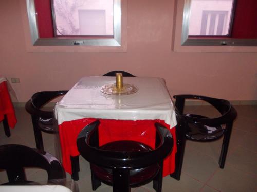 a table with a red and white table cloth at Scacco Rosso in SantʼEgidio alla Vibrata