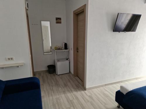 TV a/nebo společenská místnost v ubytování YUKA