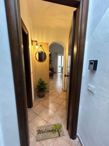 a hallway of a house with a door open at Vicolo 35 Apartments in Trapani