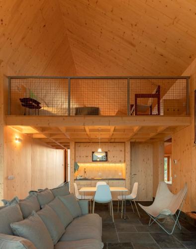a living room with a couch and a loft at QUINTA DA FAÍSCA - Agro Turismo in Favaios