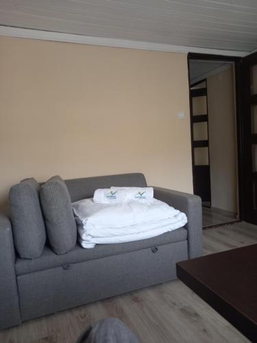 a couch with towels on it in a room at Halny Natura Tour in Karpacz