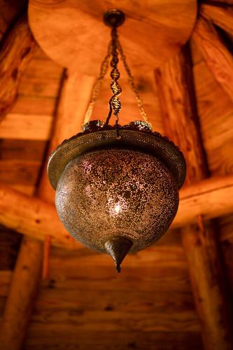 a chandelier hanging from the ceiling of a room at Little Hollows Glamping in Little Malvern