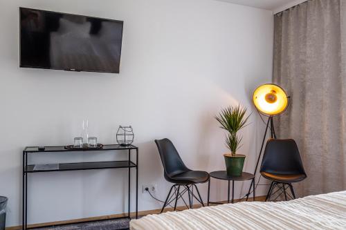 TV a/nebo společenská místnost v ubytování Hotel Fuchs & Hase SELF CHECK IN