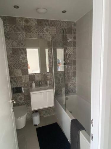 a bathroom with a tub and a sink and a shower at Fruit Market Hull in Hull
