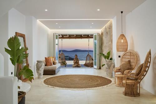a living room with a view of the ocean at Ubud Mykonos in Agios Ioannis Mykonos