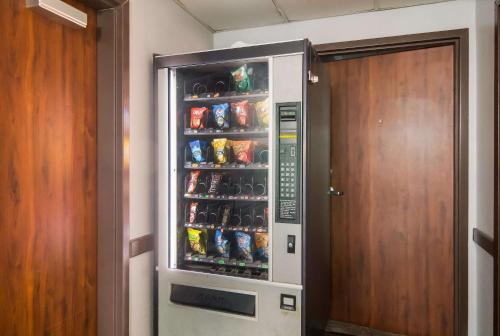 a refrigerator filled with lots of drinks in a room at Quality Inn & Suites in Waco