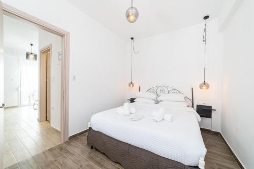 Postel nebo postele na pokoji v ubytování Danai & Palm Residential Complexes