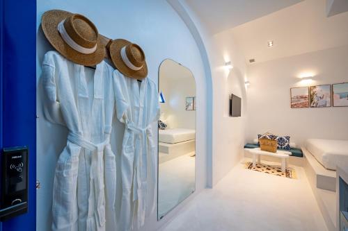 a dressing room with a mirror and a hat at Happiness Hotel in Quy Nhon