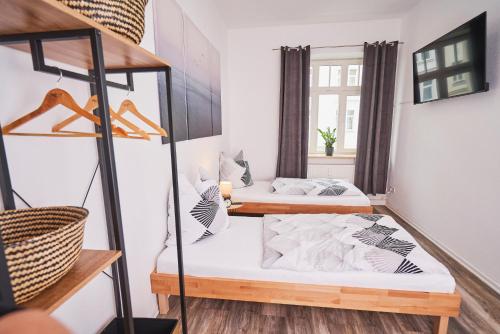 Ένα ή περισσότερα κρεβάτια σε δωμάτιο στο Gemütliche Ferienwohnung für die ganze Familie