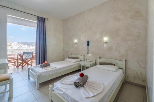 Cama o camas de una habitación en Sunrise Hotel