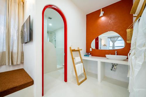 a bathroom with a sink and a mirror at Happiness Hotel in Quy Nhon