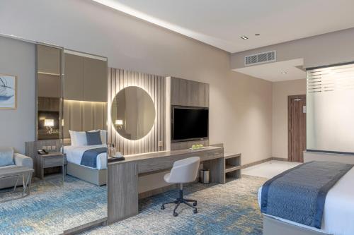 Ένα ή περισσότερα κρεβάτια σε δωμάτιο στο Seven Gardens Hotel