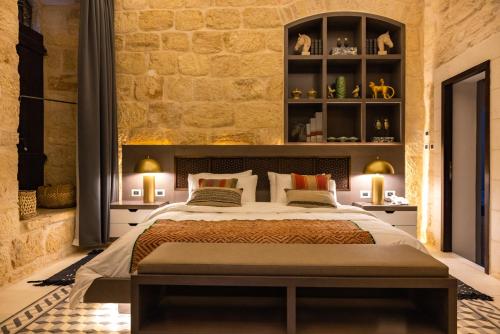 Postel nebo postele na pokoji v ubytování Kassa Boutique Hotel