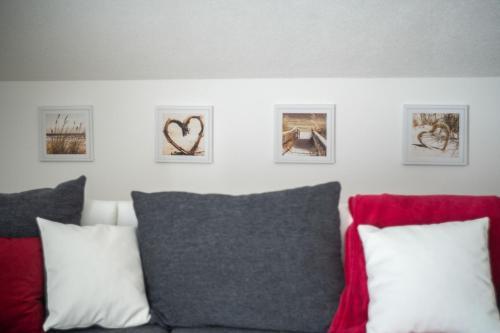 a room with a couch and some pictures on the wall at Holiday House Zrmanja Vrelo in Zrmanja Vrelo