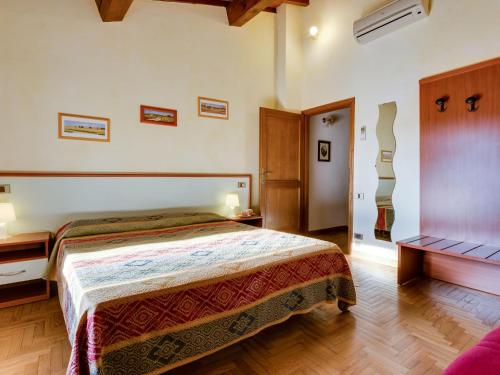 Ένα ή περισσότερα κρεβάτια σε δωμάτιο στο Holiday Home Il Colombaino by Interhome