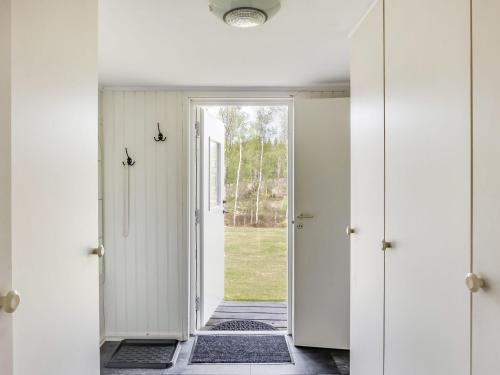 a hallway with a door leading to a yard at Chalet Björkebo by Interhome in Ätran