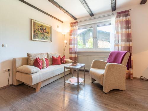 a living room with a couch and two chairs at Apartment Am Hohen Bogen-26 by Interhome in Arrach
