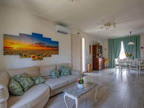 a living room with a couch and a table at Holiday Home del Sole by Interhome in Bientina