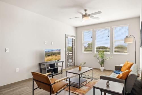 a living room with a couch and a table at Spacious Westgate CozySuites by stadium with pool 2 in Glendale