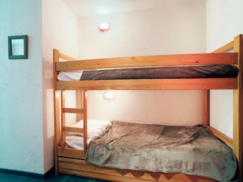 quelques lits superposés dans une chambre dans l'établissement Studio La Piste B71 by Interhome, à Saint-Gervais-les-Bains