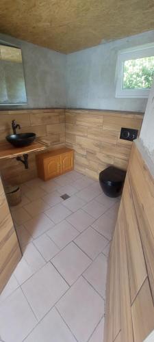 a small bathroom with a sink and a toilet at Gästehaus Kathi Campingplatz Buschcamper in Gyenesdiás