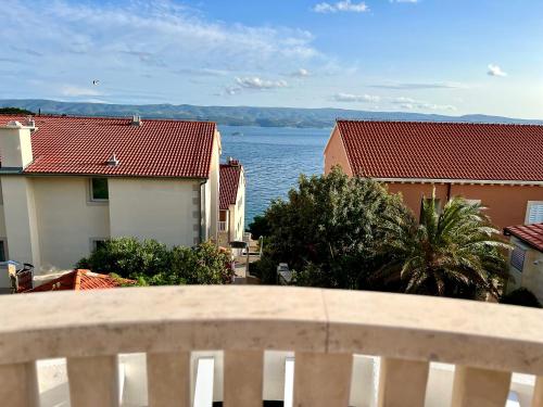 a view of the ocean from the balcony of a house at Villa Romana II Omis in Omiš