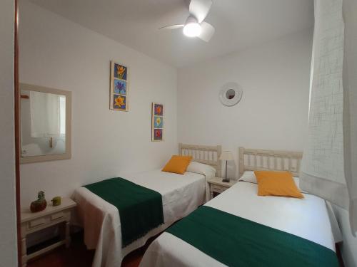 Posteľ alebo postele v izbe v ubytovaní La Joya Apartment