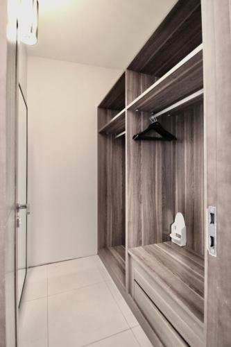 a bathroom with wooden walls and a shower stall at Super Stay Hotel, Oslo in Oslo