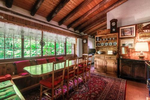 a dining room with a table and chairs at Casa al Fiume by Quokka 360 - House by the River in the Verzasca Valley in Lavertezzo