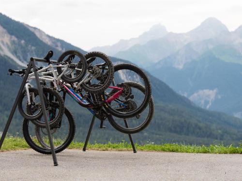 two bikes on a rack with mountains in the background at Apartment Raschainas Lenzerheide by Interhome in Sporz