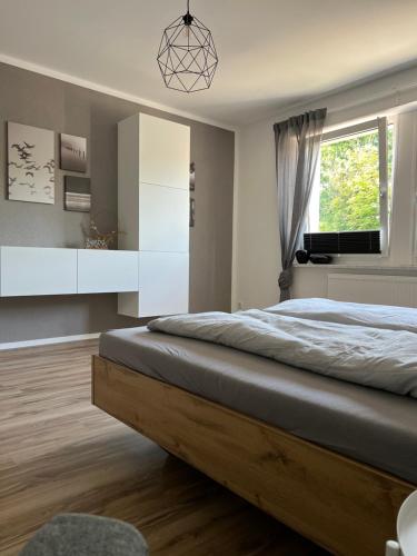 a bedroom with a large bed and a window at Apartment in Weiden i. d. Opf. in Weiden