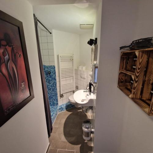 a bathroom with a toilet and a sink at Apartments im Einhornhaus in Lübeck
