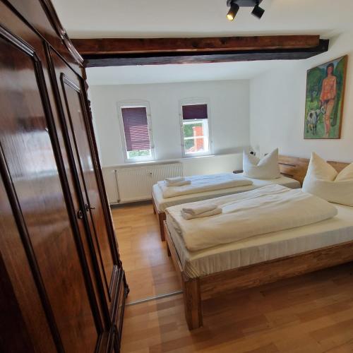 two beds in a room with two beds sidx sidx sidx at Apartments im Einhornhaus in Lübeck
