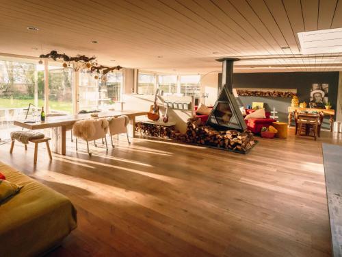 a living room with a fireplace in the center of the room at Villa Domicile adoré by Interhome in Ostend