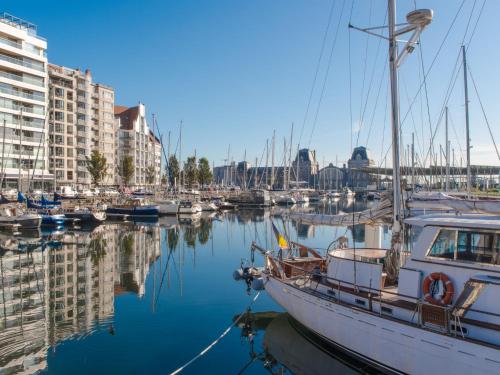 a group of boats docked in a marina with buildings at Villa Domicile adoré by Interhome in Ostend