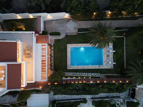 an overhead view of a swimming pool in a yard at Kamariyo Athens Riviera by A&D Properties in Palaia Fokaia