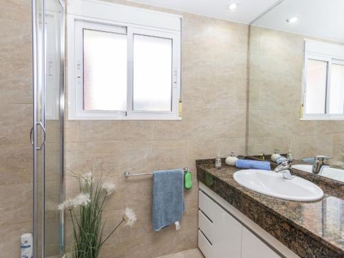 a bathroom with a sink and a shower at Apartment Gabriel by Interhome in Sant Jordi